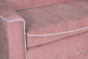 Marbella sofa bed in pink with white piping 